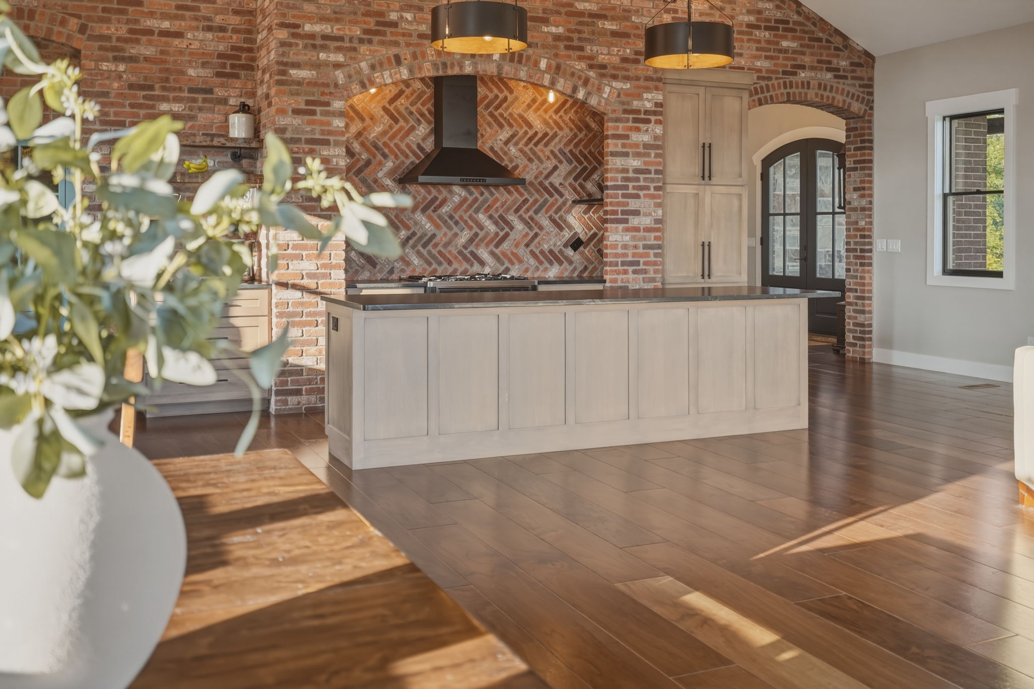 Open-concept living and kitchen looking out over the river valley
