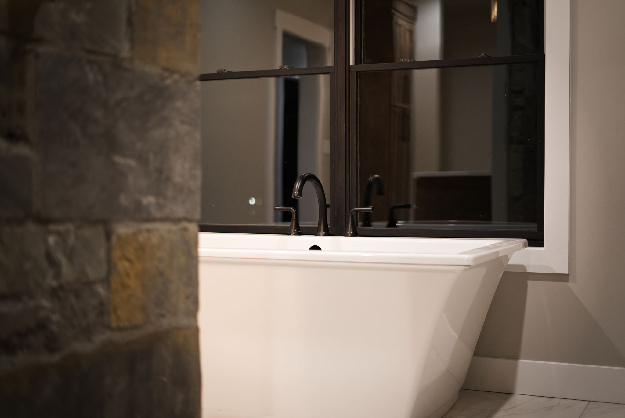 Primary bath soaking tub in the window nook